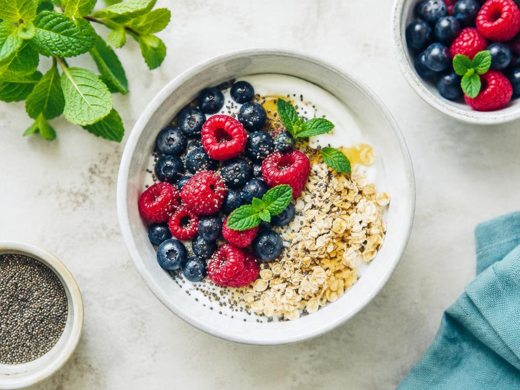A nourishing gut-health bowl with yogurt, berries, oats and chia seeds